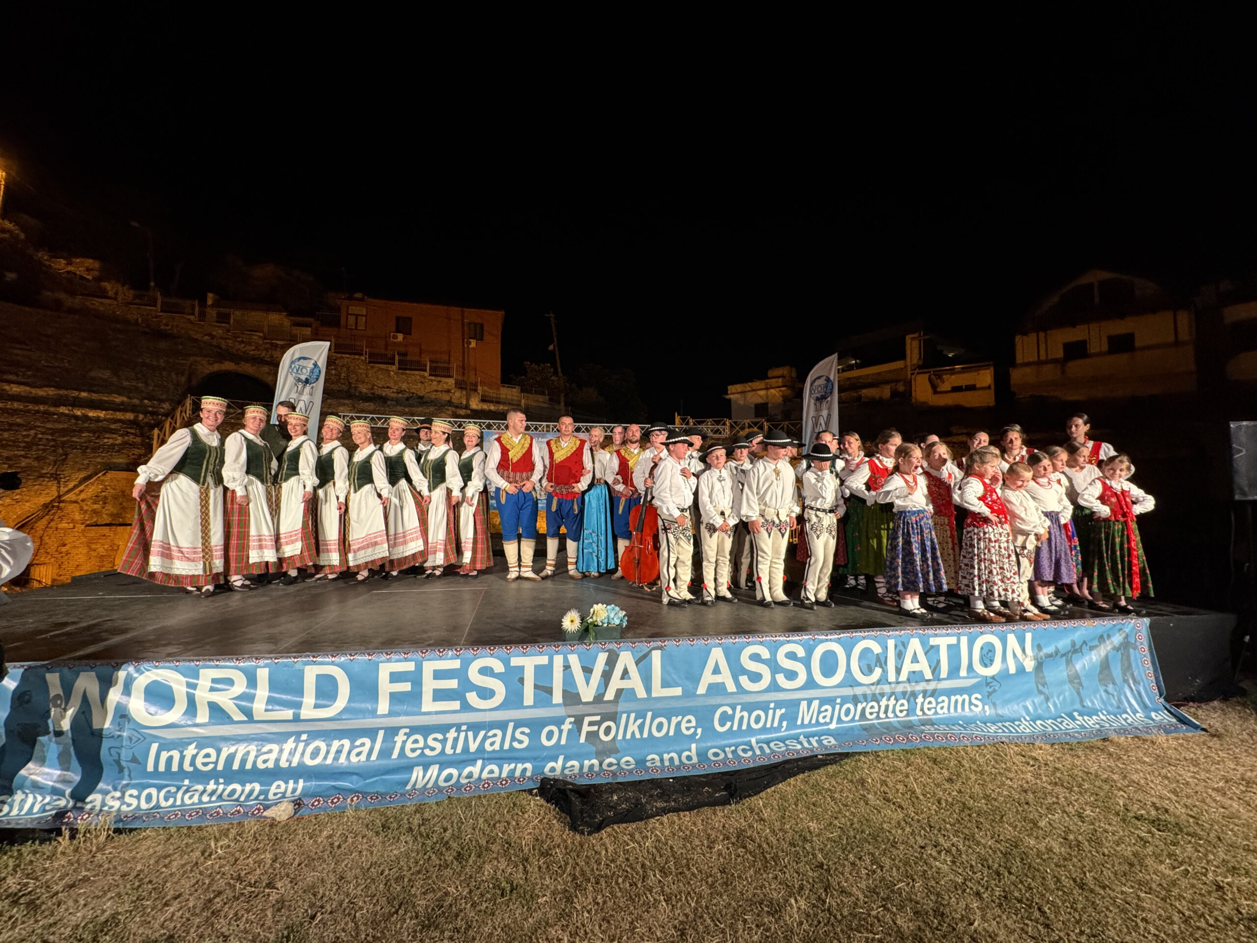 Folk and Choral groups posing for pictures at the WOFA Festival in Durres