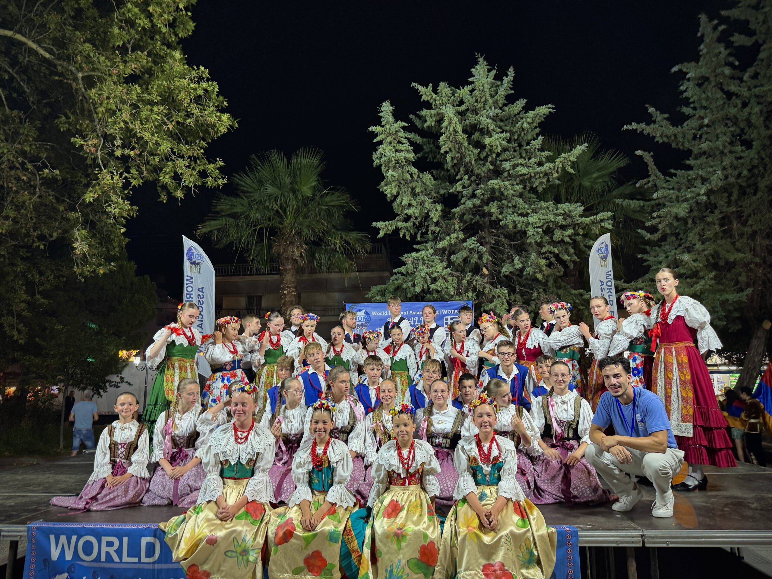 Groups posing for picture at the WOFA Festival in Paralia, Greece
