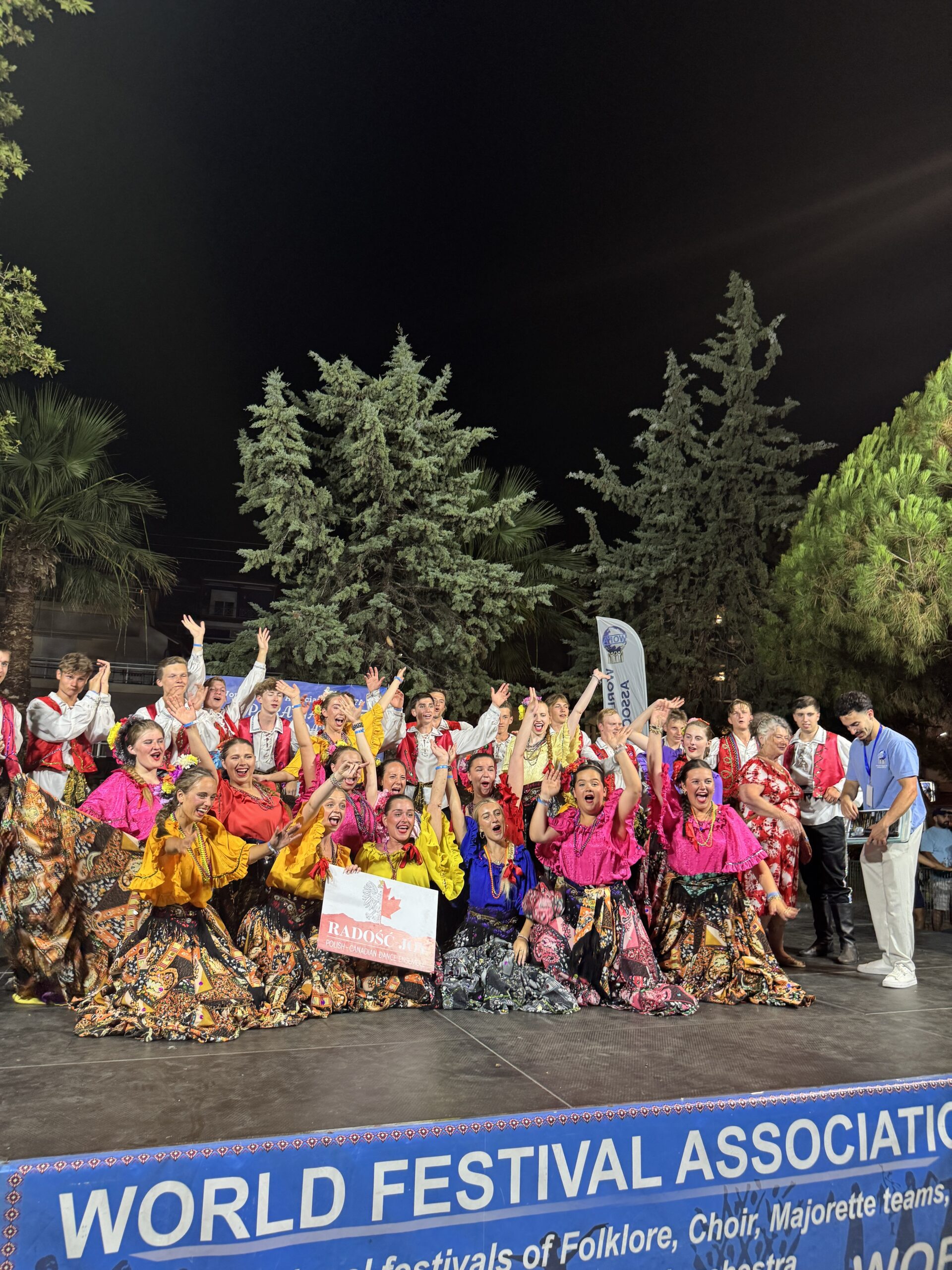 Groups doing a group photo at the WOFA Festival in Paralia, Greece