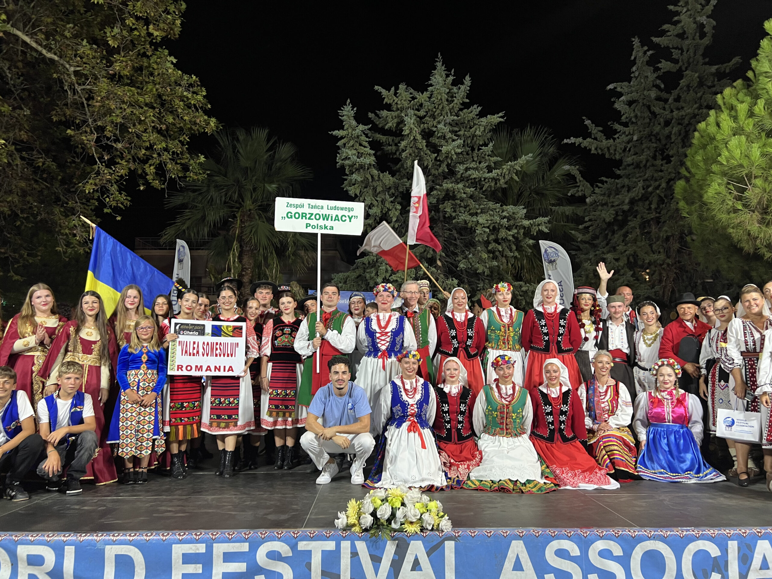Groups posing for picture at the WOFA Festival in Paralia, Greece